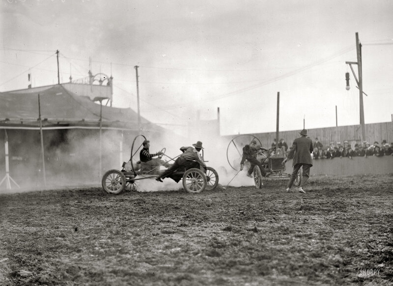 Early car race on dirt track