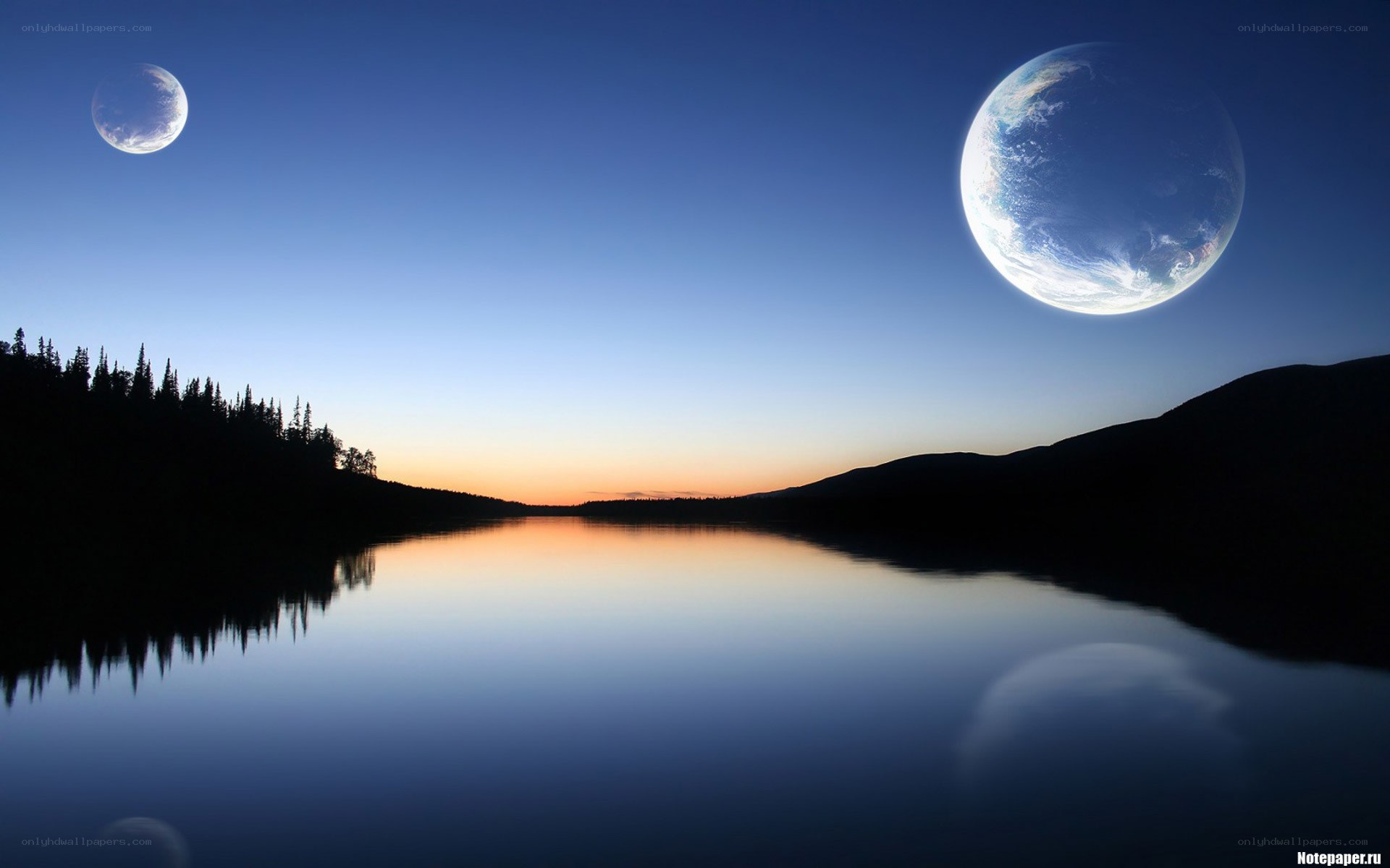 Earth and moon over a lake