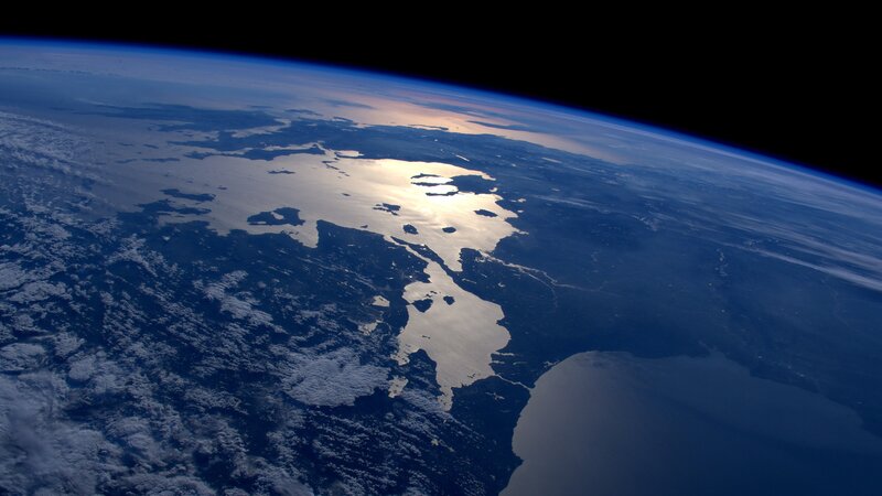 Earth from Space — Blue, Serene, Sunrise, Photograph, Clouds, Ocean