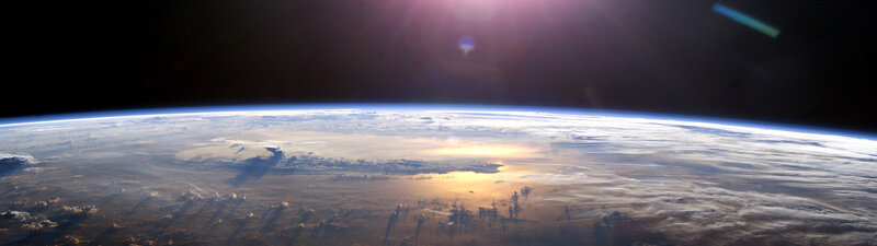 Earth from Space — Blue, Serene, Sunrise, Photograph, Sun, Clouds