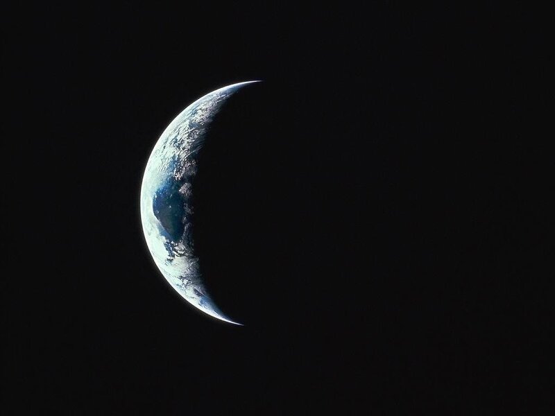 Earth from space crescent view