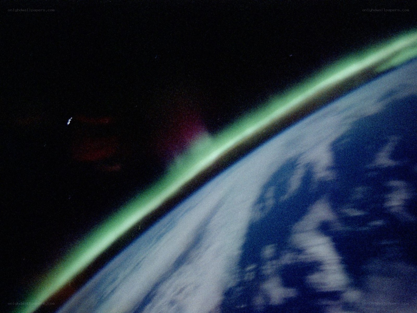 Earth from space with aurora