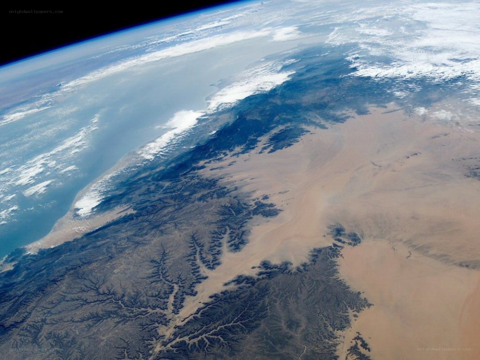 Earth from space with desert and ocean