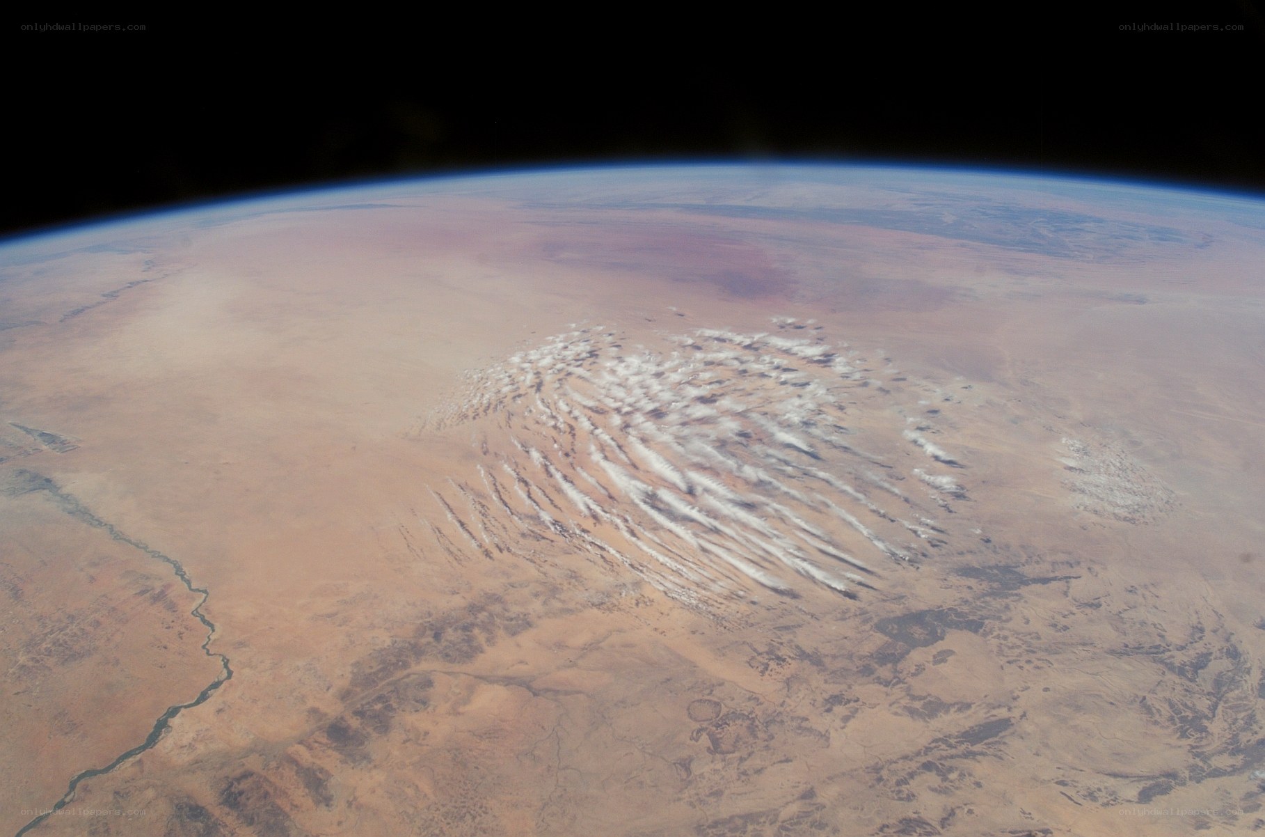Earth from space with desert clouds