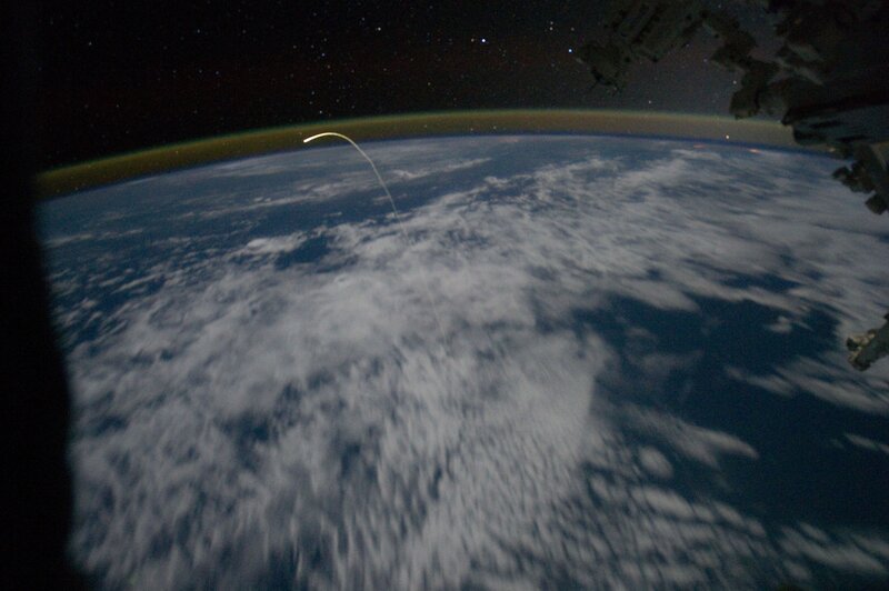 Earth from space with rocket launch