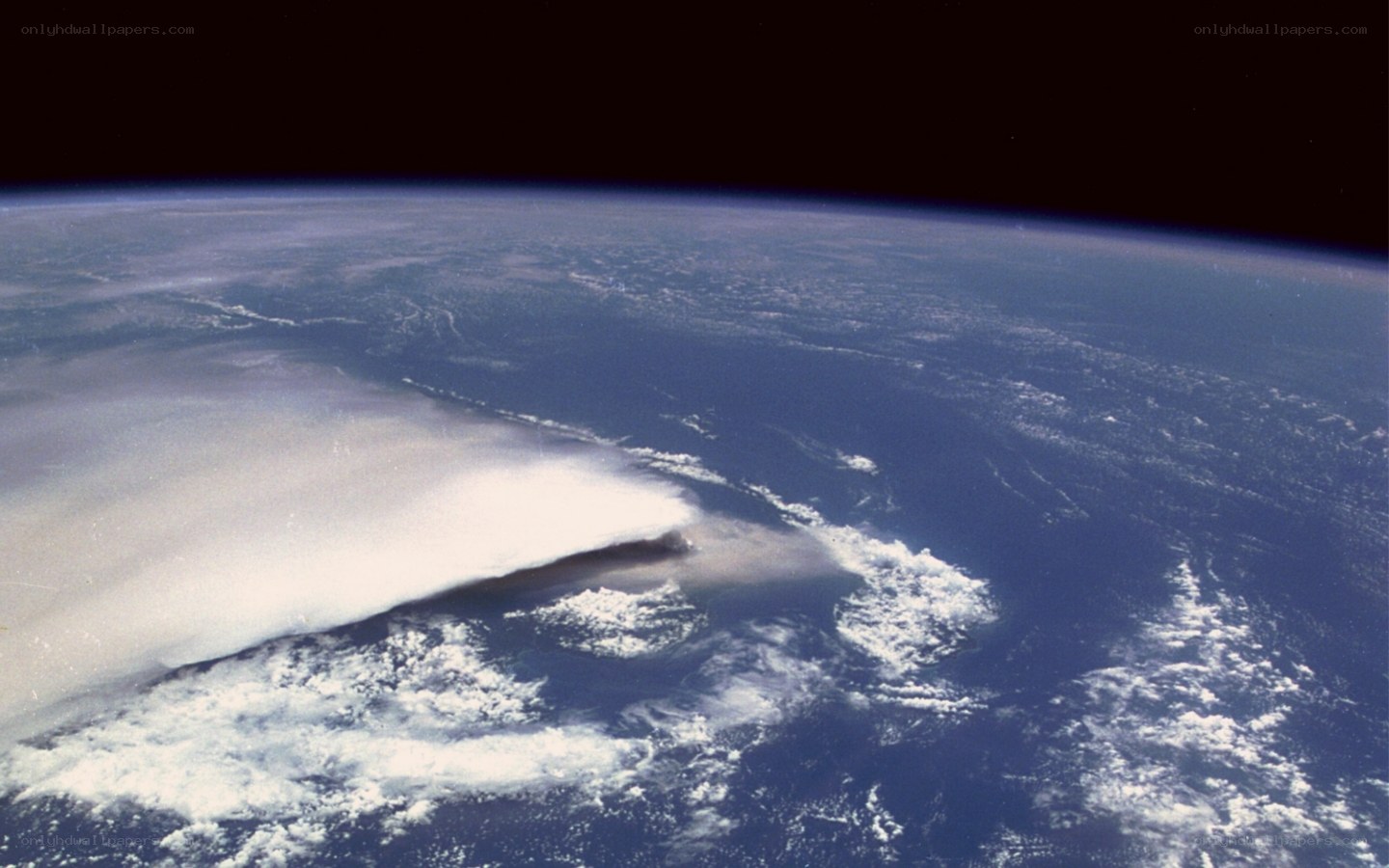 Earth from space with smoke plume