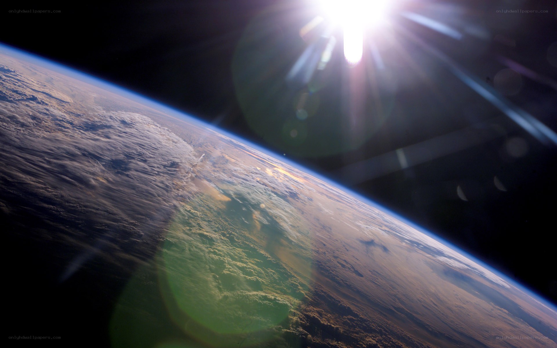 Earth from space with sun glare