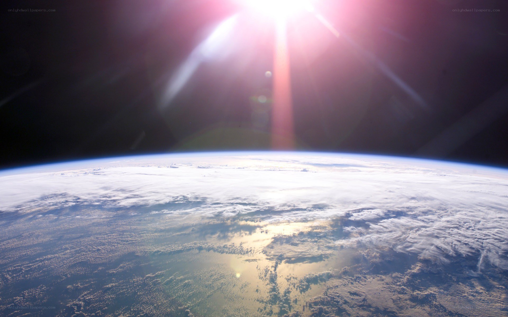 Earth from space with sun glare