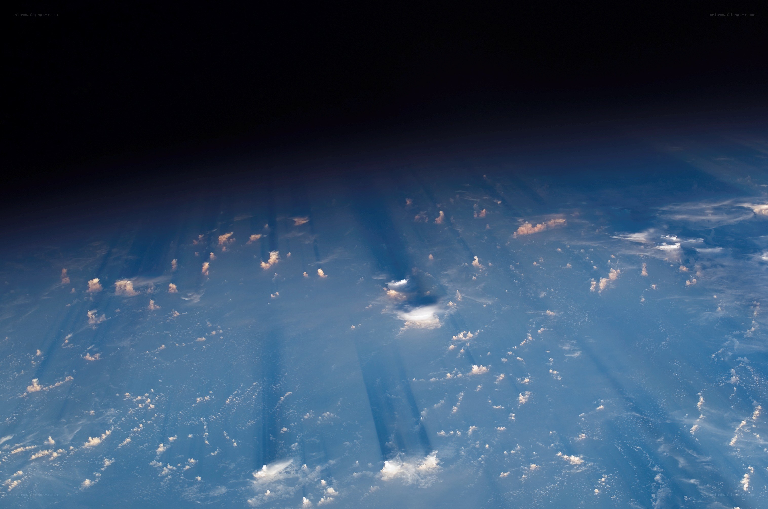 Earth from space with sunbeams