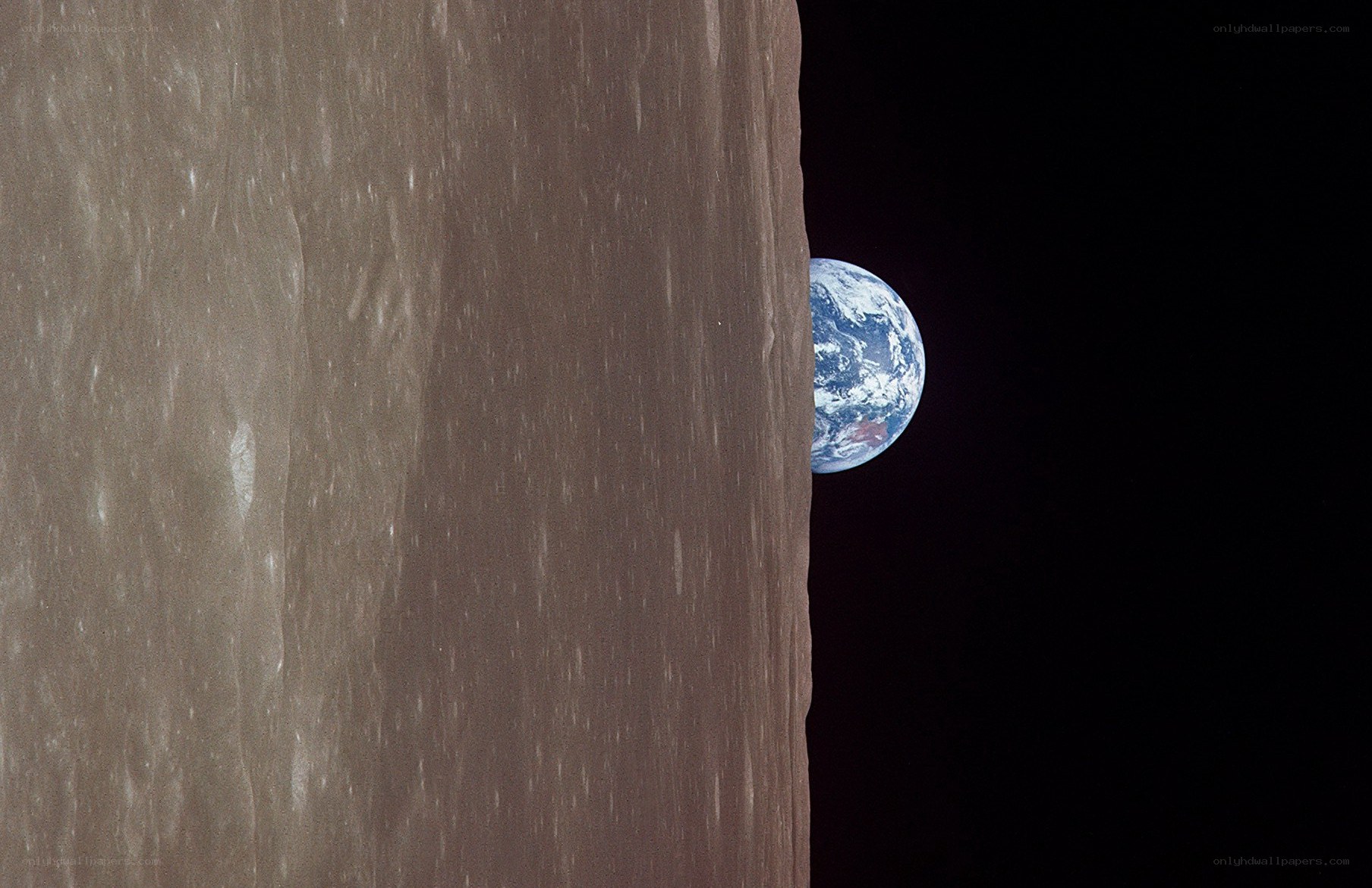 Earth rising over the Moon