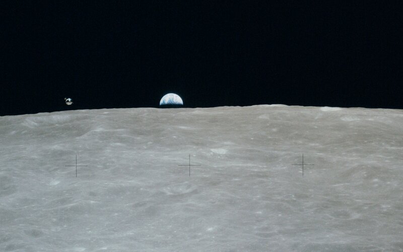 Earthrise over Lunar Surface
