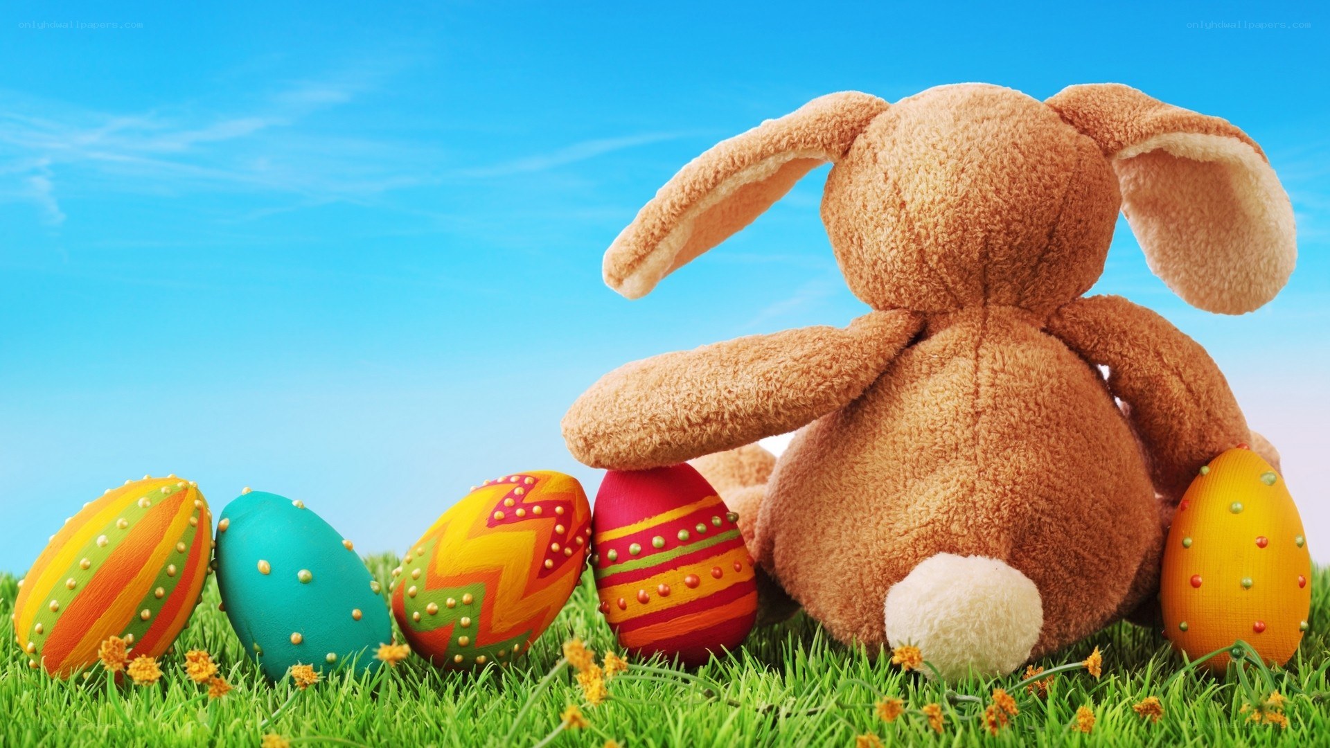 Easter bunny with colorful eggs