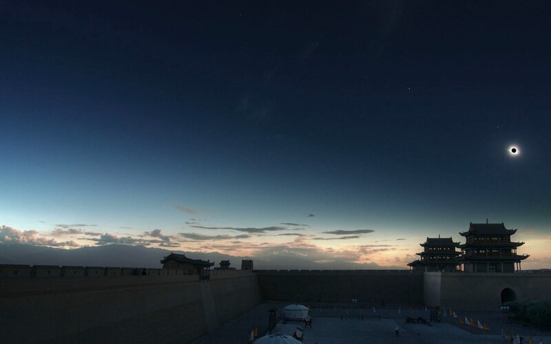 Eclipse over ancient fortress
