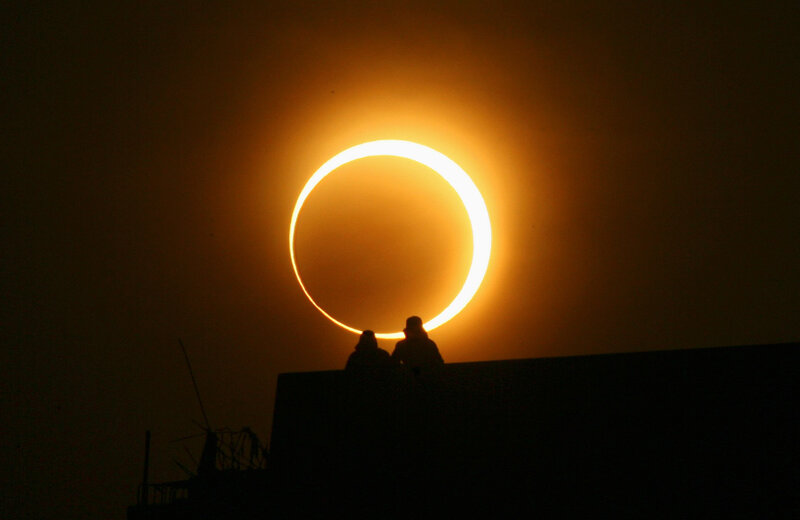 eclipse with silhouettes
