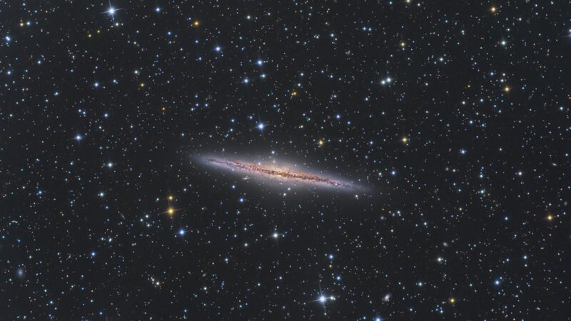 Edge-on spiral galaxy in starfield