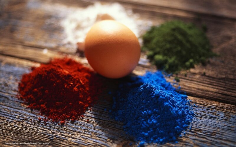 Egg and colored powders on wood