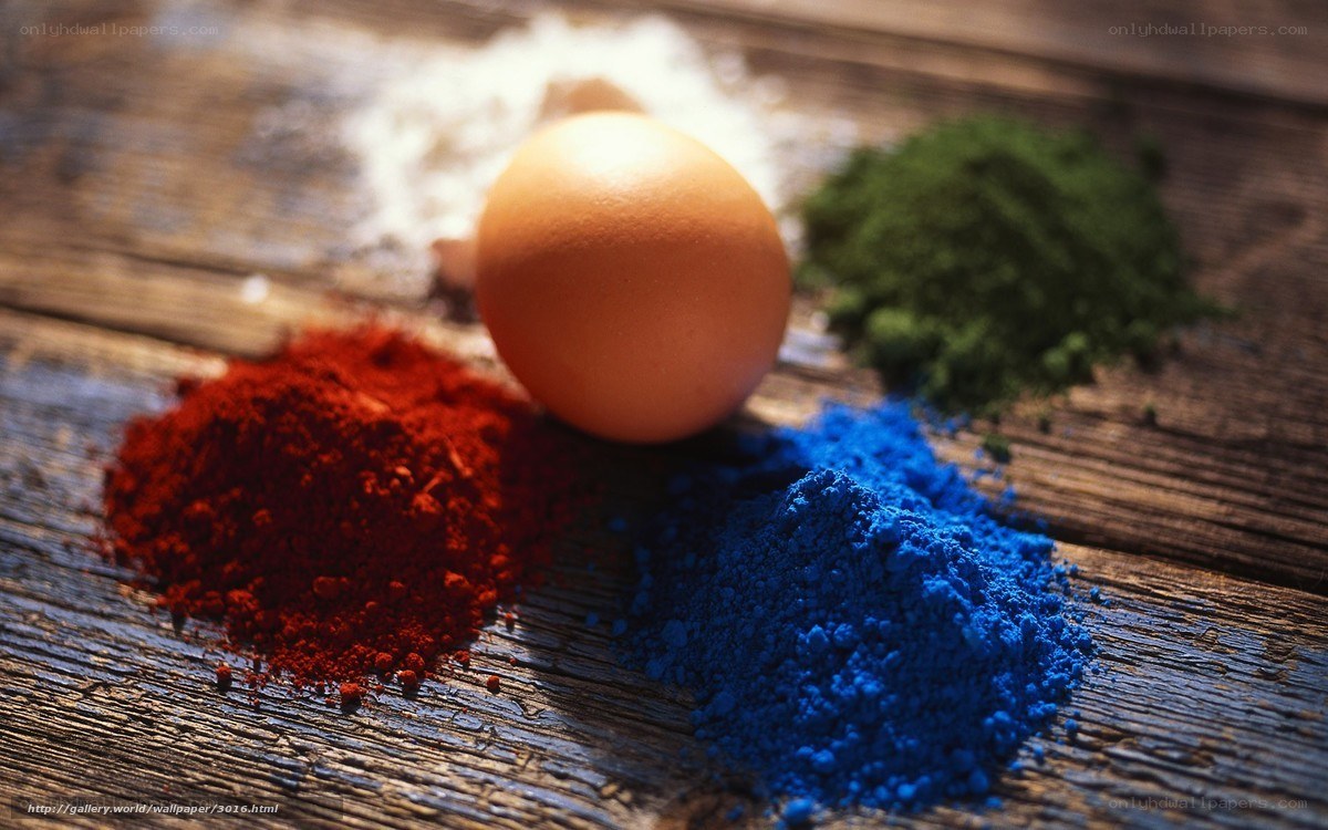 Egg and colored powders on wood