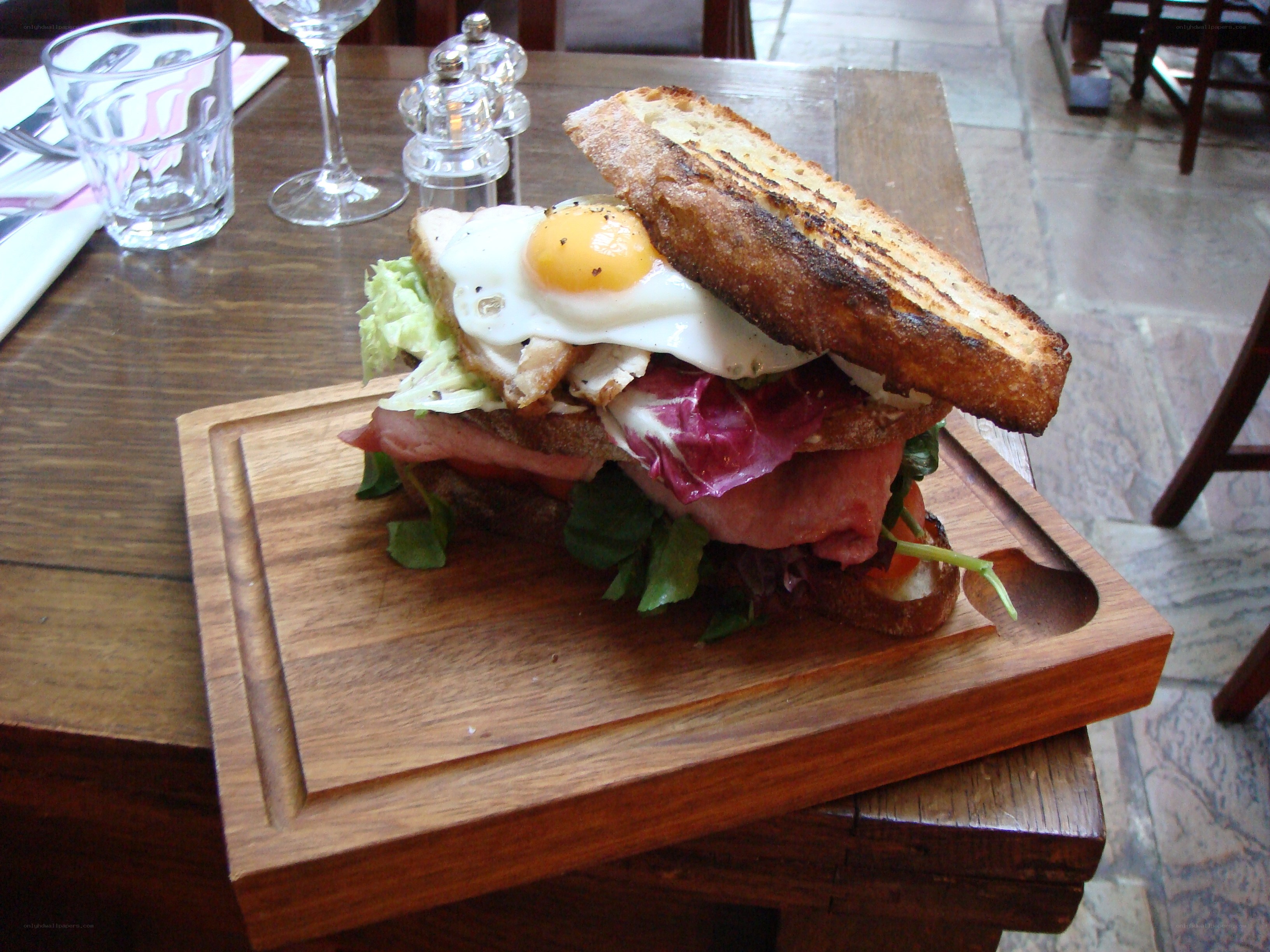 Egg sandwich on wood board
