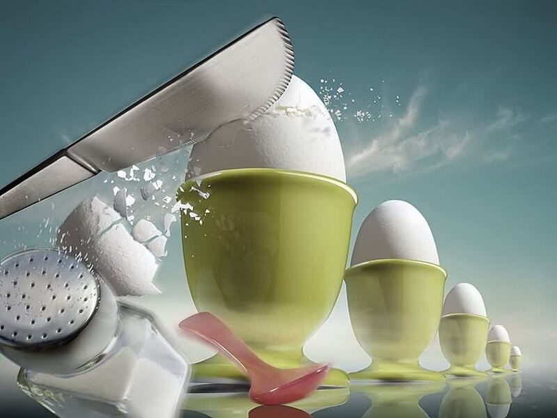 Eggs being cracked with a knife