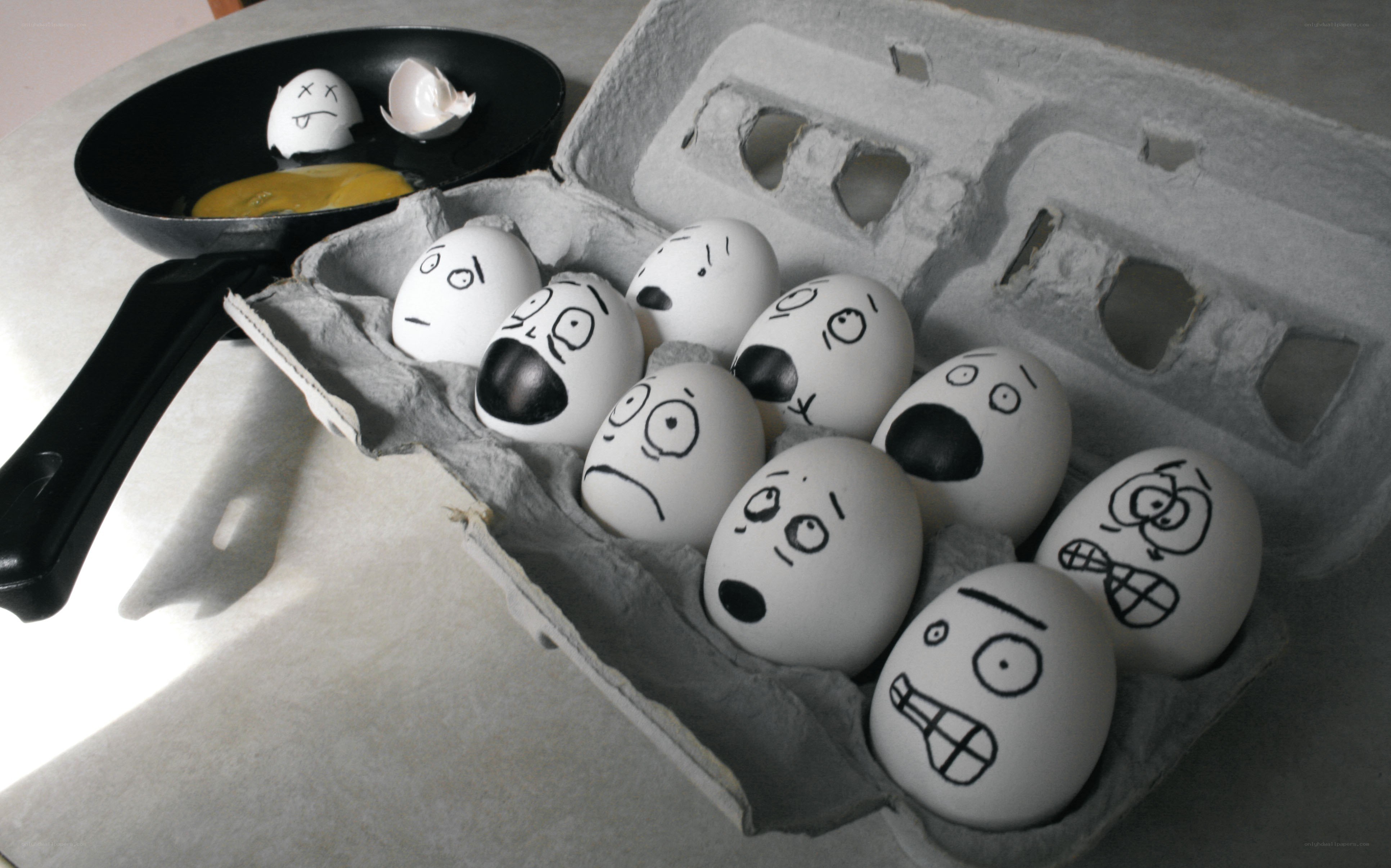 Eggs in a carton with faces