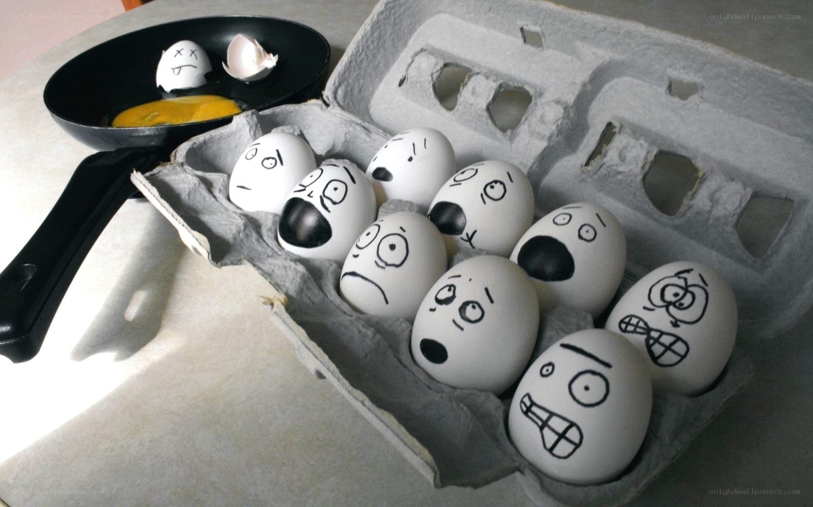 Eggs in a carton with faces