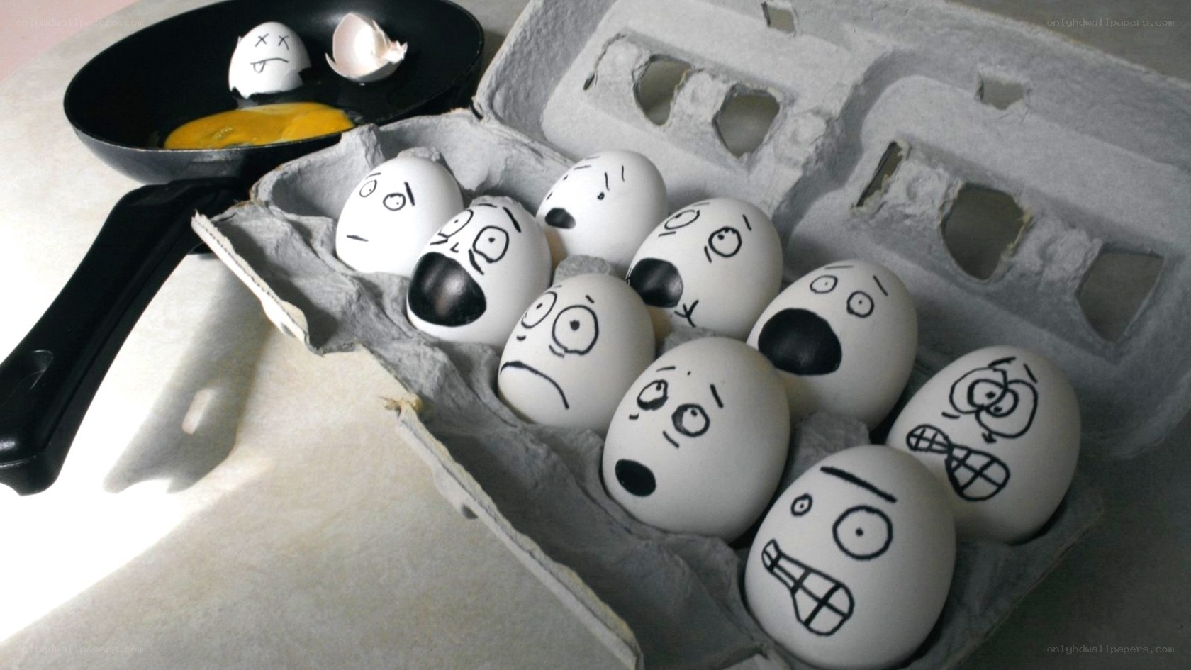 Eggs in a carton with faces