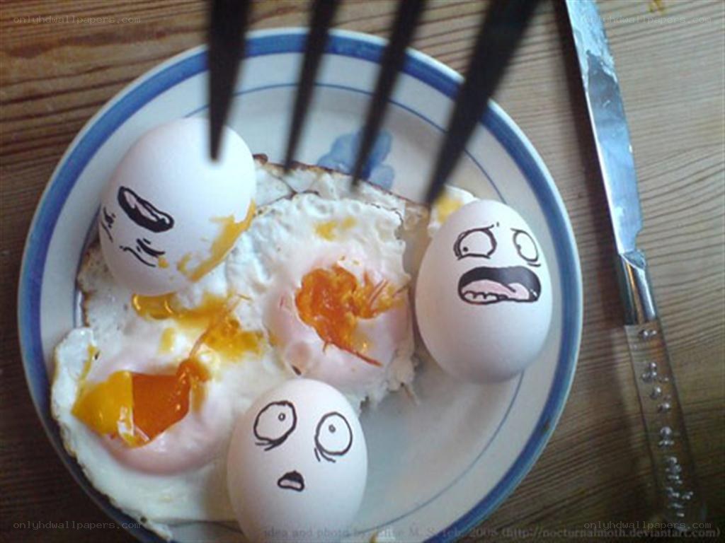 Eggs with drawn faces on plate