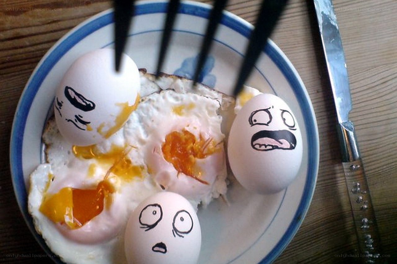 Eggs with drawn faces on plate