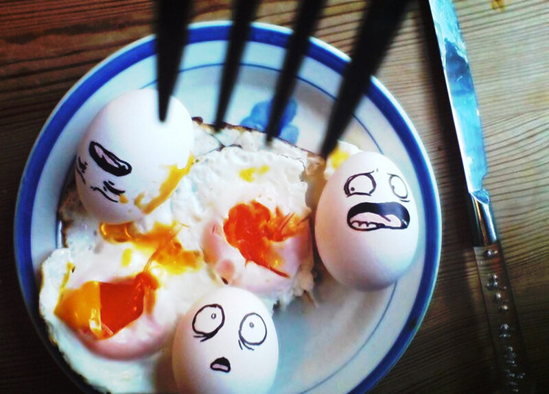 Eggs with drawn faces on plate