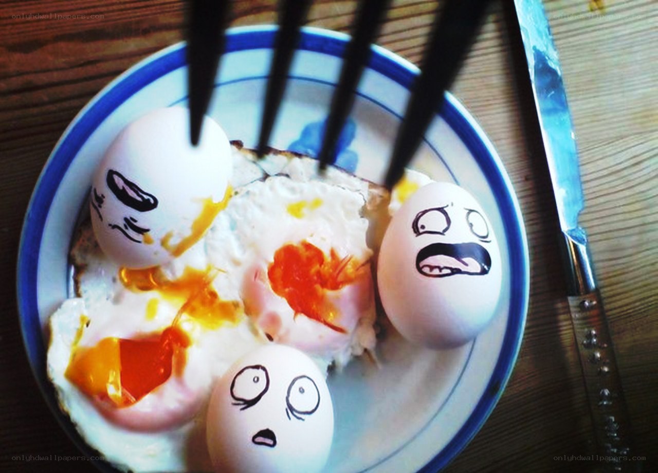 Eggs with drawn faces on plate