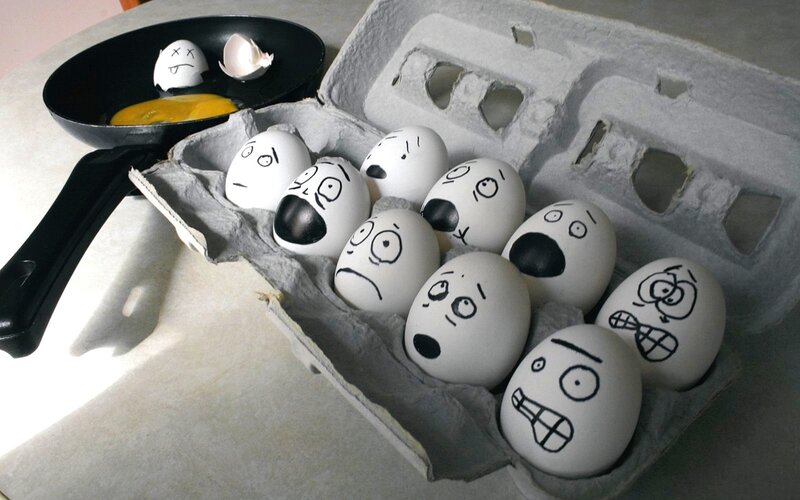 Eggs with Faces in Carton — White, Dramatic, Photograph