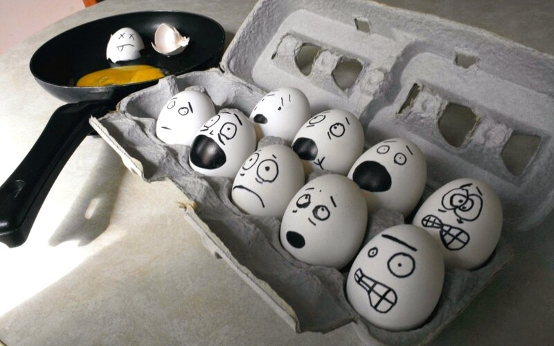 Eggs with Faces in Carton — White, Dramatic