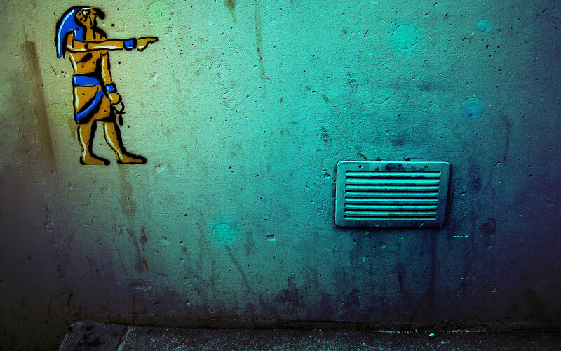 Egyptian figure graffiti on wall