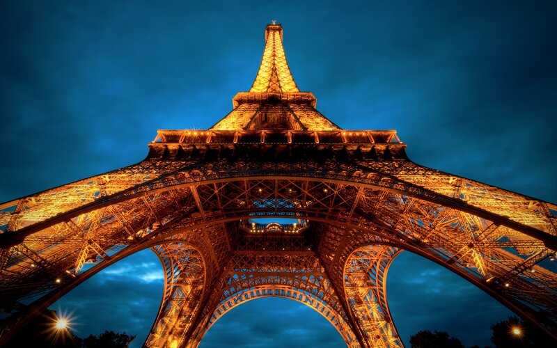 Eiffel Tower at Night — Blue, Dramatic, Photograph, Sky, Lights, Trees, Yellow