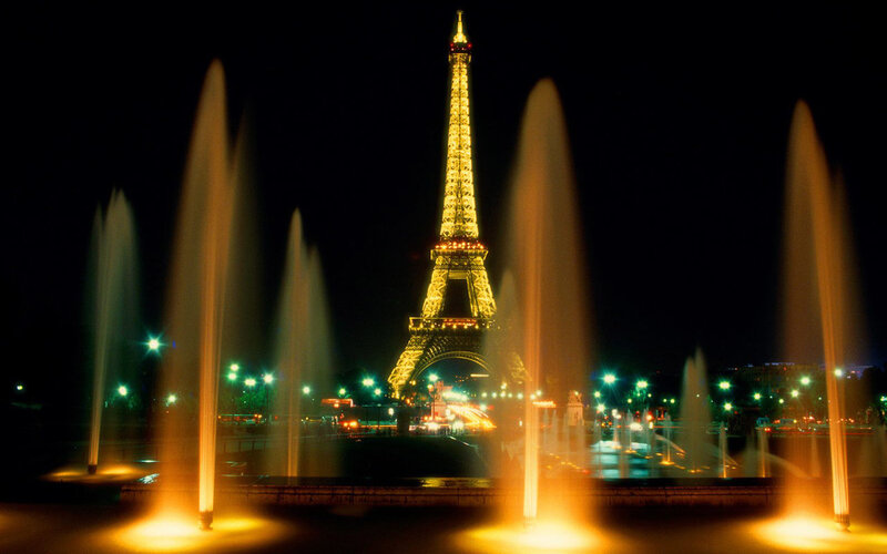 Eiffel Tower at night with fountains