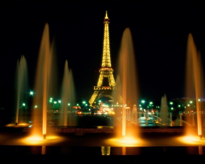 Eiffel Tower at night with fountains