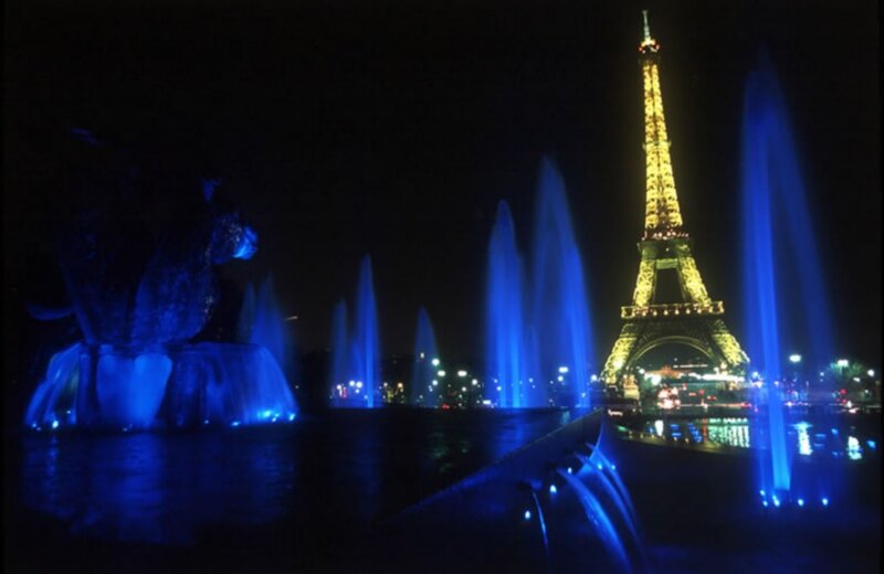 Eiffel Tower at night with fountains