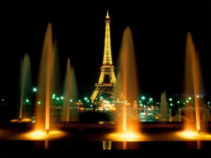 Eiffel Tower at night with fountains