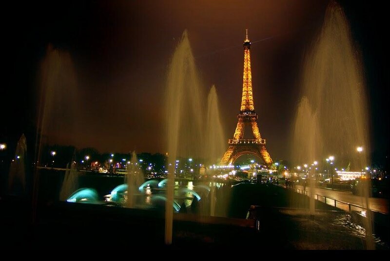 Eiffel Tower at night with fountains