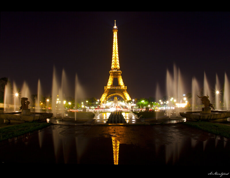 Eiffel Tower at night with fountains
