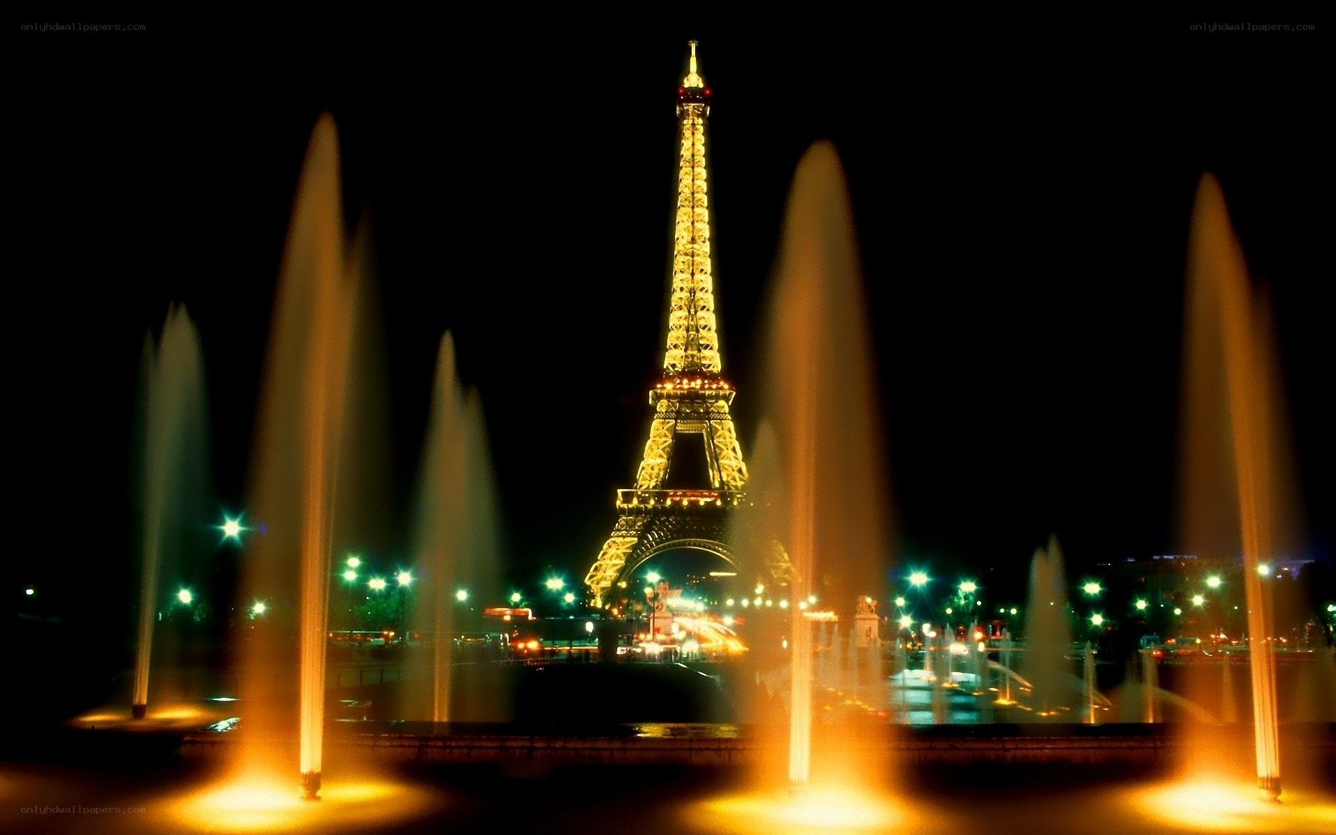 Eiffel Tower at night with fountains