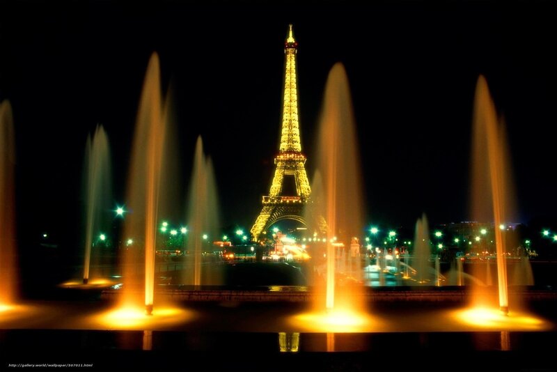 Eiffel Tower at night with fountains