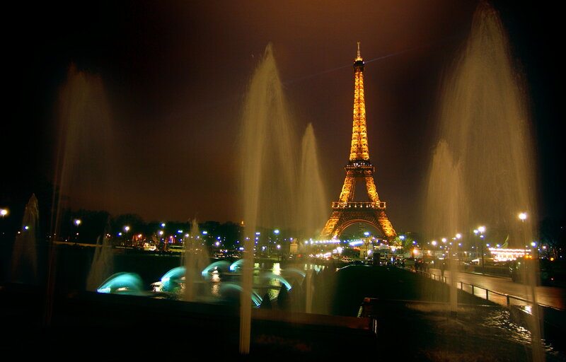 Eiffel Tower at night with fountains