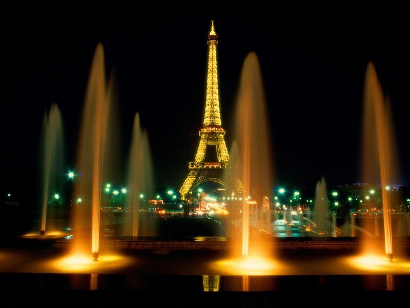 Eiffel Tower at night with fountains