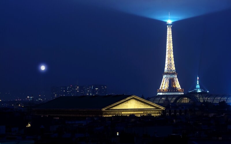 Eiffel Tower at night with moon