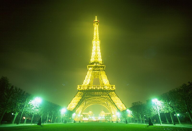 Eiffel Tower at Night — Yellow, Dramatic, Photograph, Trees, Streetlights