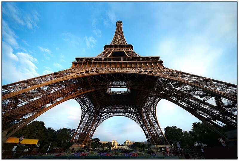 Eiffel Tower Base — Blue, Dramatic, Afternoon, Photograph, Sky, Trees