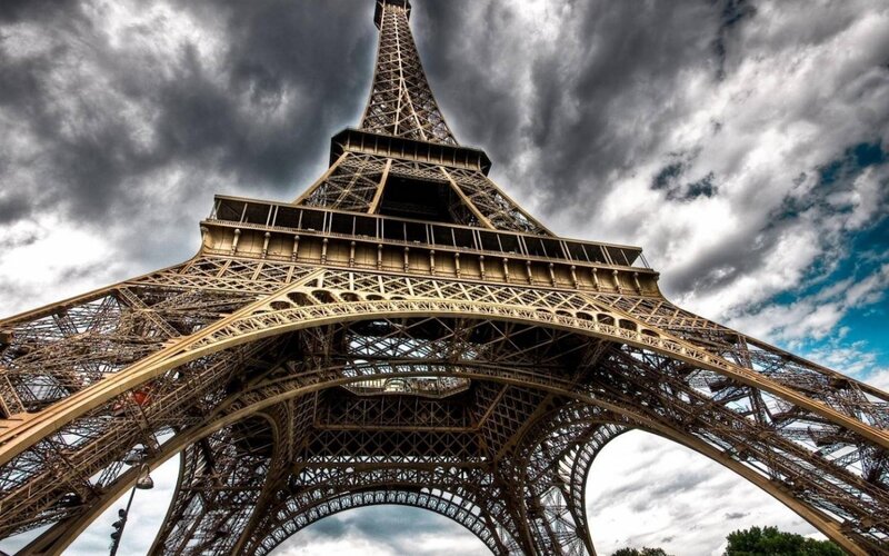 Eiffel Tower Base — Gray, Dramatic, Afternoon, Photograph, Clouds