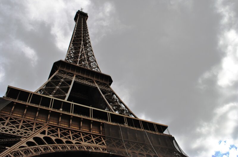 Eiffel Tower Base — Gray, Dramatic, Photograph, Clouds