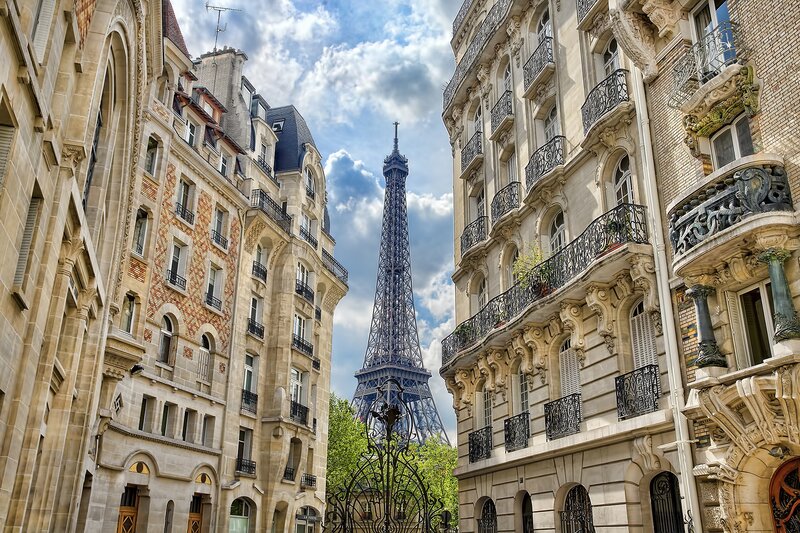 Eiffel Tower between Parisian buildings